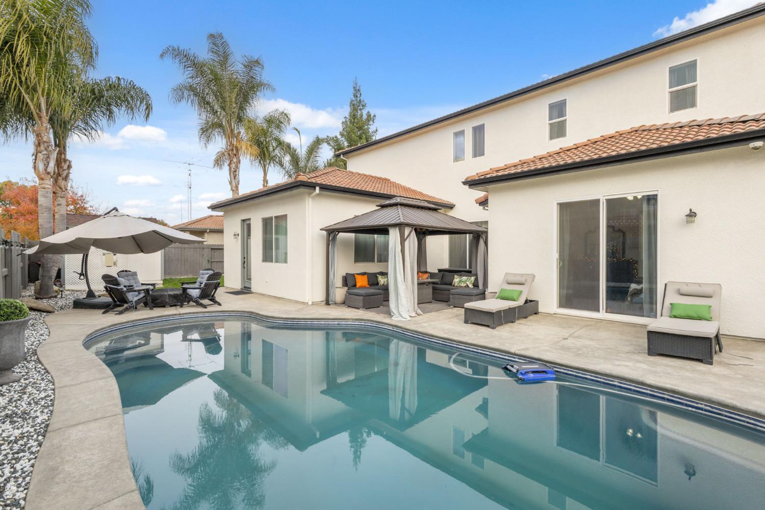 4215 Riopel Avenue Denair, CA 95316 - Photo 43 of 62 a front view of a house with swimming pool