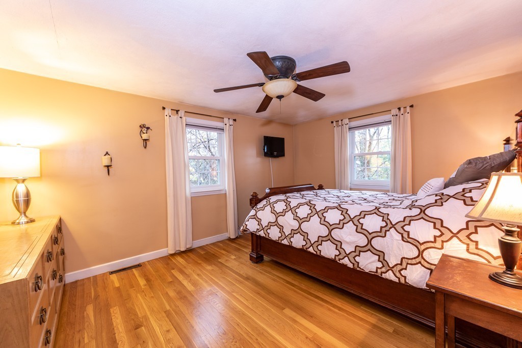 61 Volk Road Dedham, MA 02026 - Photo 17 of 26 a bedroom with a bed and window
