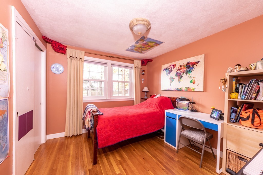 61 Volk Road Dedham, MA 02026 - Photo 20 of 26 a bedroom with furniture and a window