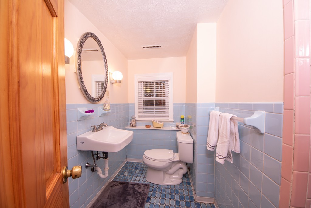 61 Volk Road Dedham, MA 02026 - Photo 24 of 26 a bathroom with a sink toilet and a mirror