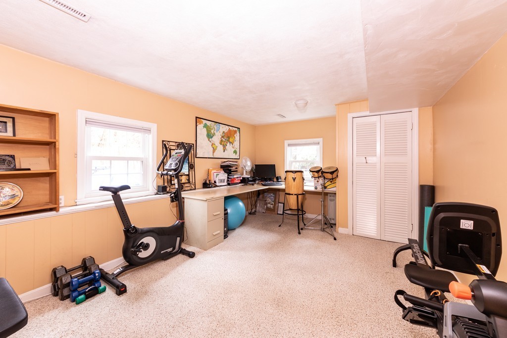 61 Volk Road Dedham, MA 02026 - Photo 25 of 26 a view of a workspace with furniture and a livingroom