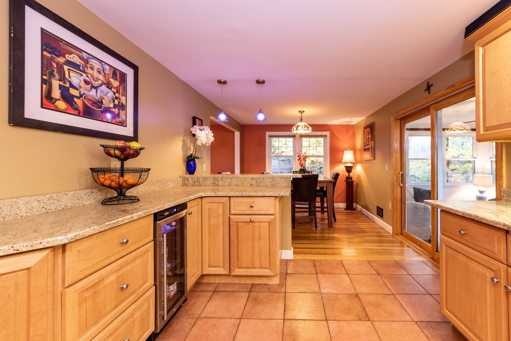 61 Volk Road Dedham, MA 02026 - Photo 6 of 26 a kitchen with stainless steel appliances granite countertop a stove and a sink