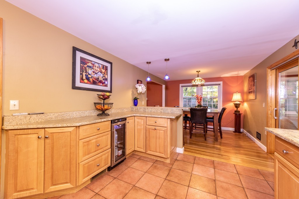 61 Volk Road Dedham, MA 02026 - Photo 7 of 26 a open kitchen with stainless steel appliances granite countertop a sink and cabinets