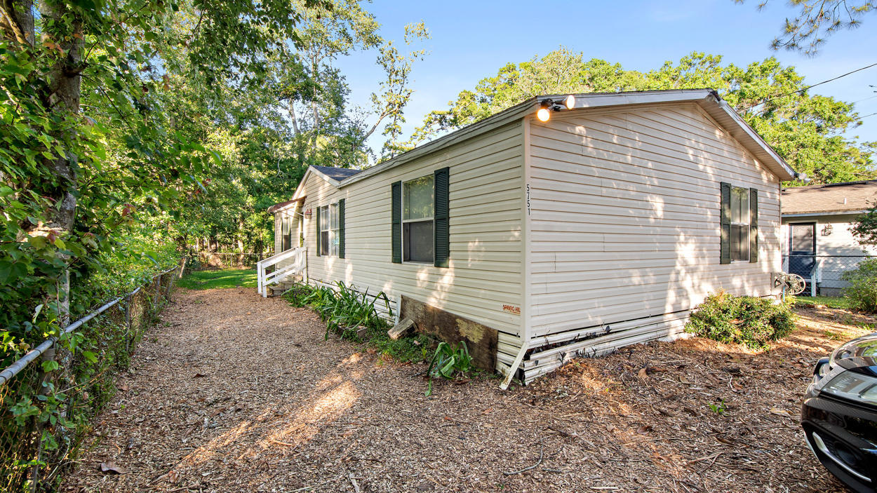 5751 Benedict Road Jacksonville, FL 32209 - Photo 1 of 11 a front view of a house with garden