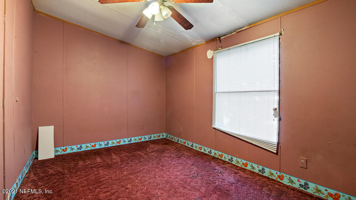5751 Benedict Road Jacksonville, FL 32209 - Photo 7 of 11 a view of an empty room with a window
