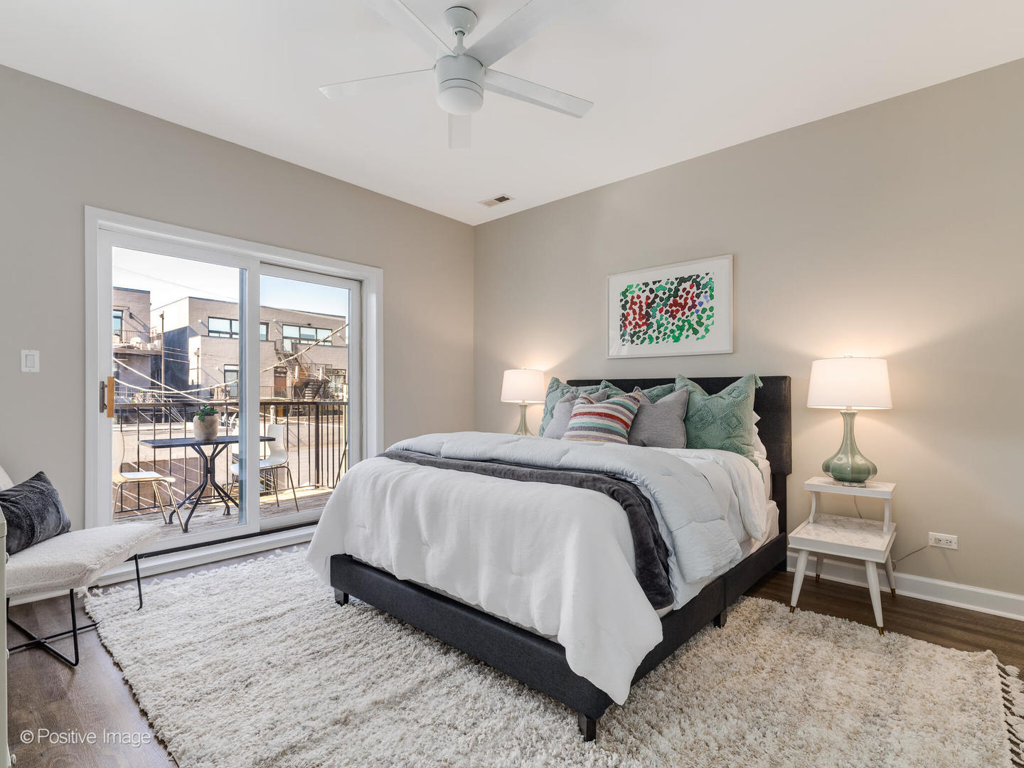 1704 South Morgan Street, Unit 2 Chicago, IL 60608 - Photo 13 of 18 a spacious bedroom with a bed and a large window