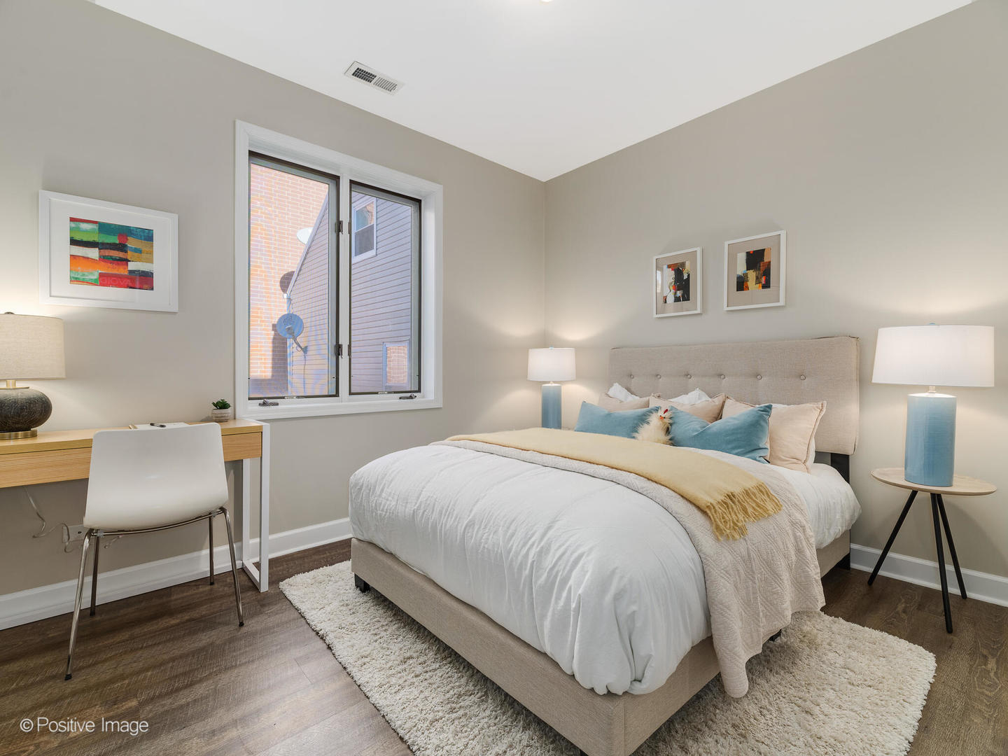 1704 South Morgan Street, Unit 2 Chicago, IL 60608 - Photo 16 of 18 a bedroom with a bed a chair and next to a window