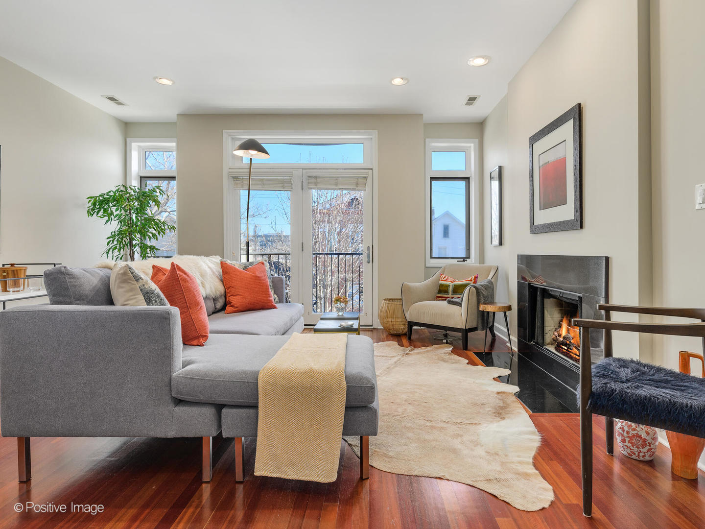 1704 South Morgan Street, Unit 2 Chicago, IL 60608 - Photo 9 of 18 a living room with furniture and a fireplace