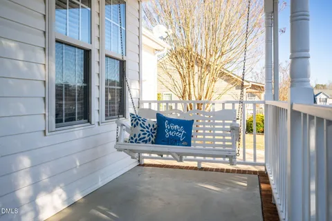 a view of a porch with seating space