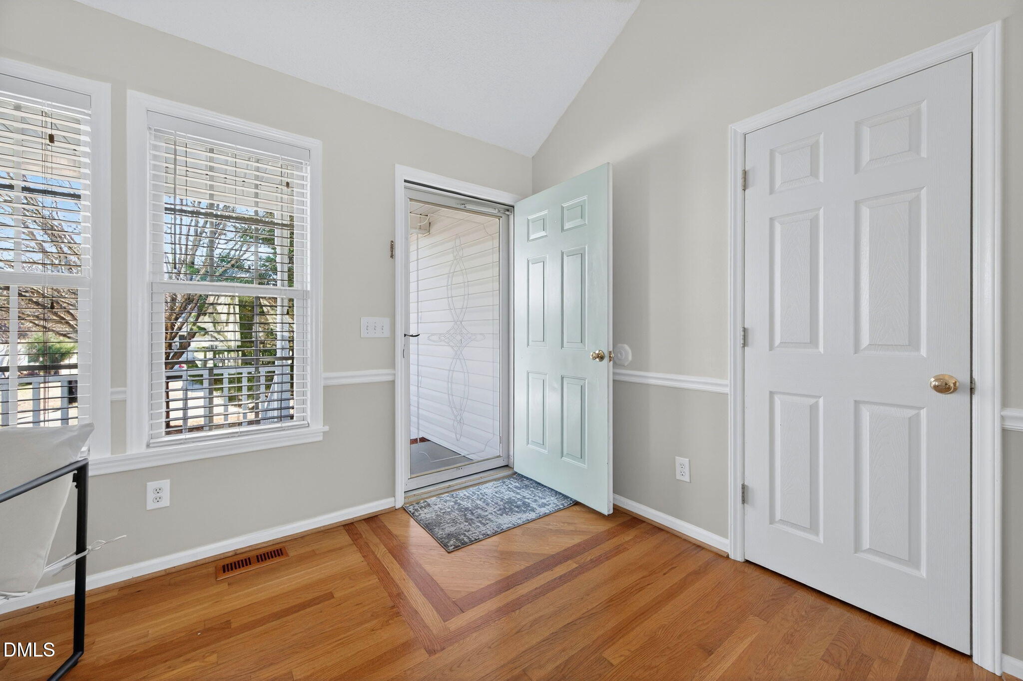 11 Hemlock Court Angier, NC 27501 - Photo 13 of 48 a view of an empty room with wooden floor and a window