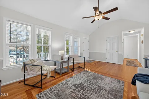 a living room with furniture rug and window