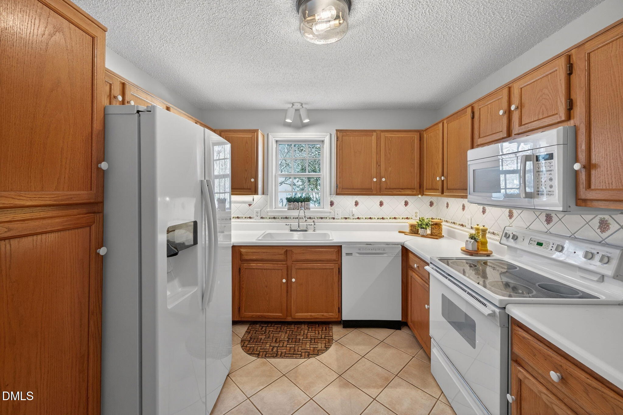 11 Hemlock Court Angier, NC 27501 - Photo 19 of 48 a kitchen with stainless steel appliances granite countertop a refrigerator sink and stove