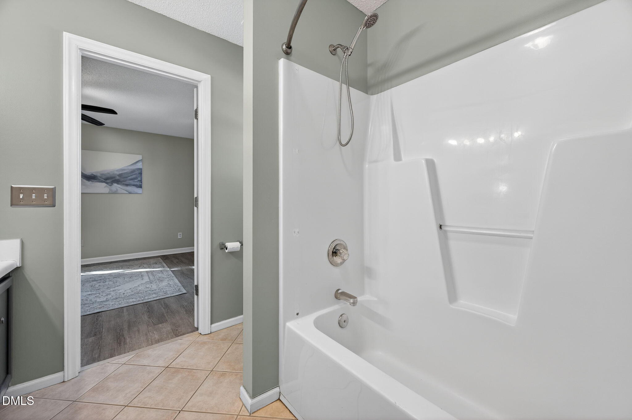 11 Hemlock Court Angier, NC 27501 - Photo 26 of 48 a bathroom with a bathtub and a shower