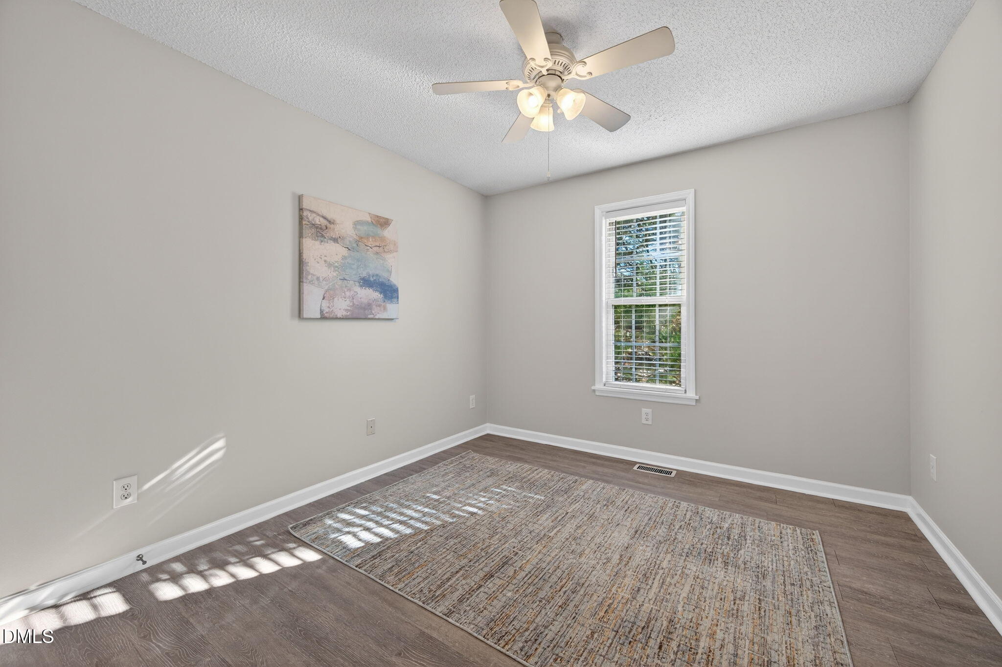 11 Hemlock Court Angier, NC 27501 - Photo 28 of 48 a view of empty room with wooden floor and fan