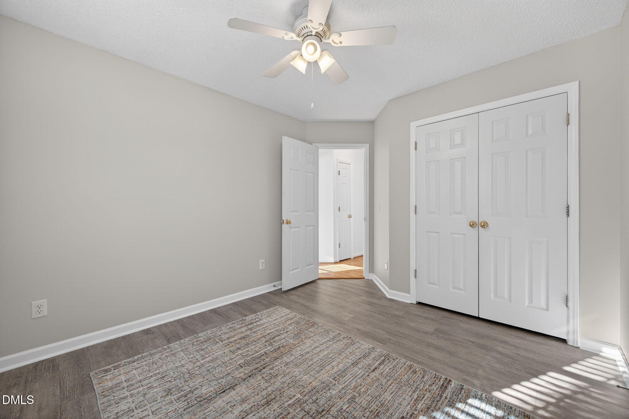 11 Hemlock Court Angier, NC 27501 - Photo 29 of 48 a view of an empty room with window chandelier fan