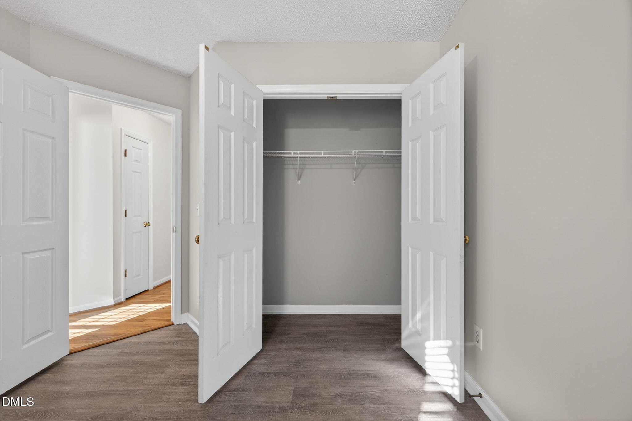 11 Hemlock Court Angier, NC 27501 - Photo 30 of 48 a view of an empty room with wooden floor & door