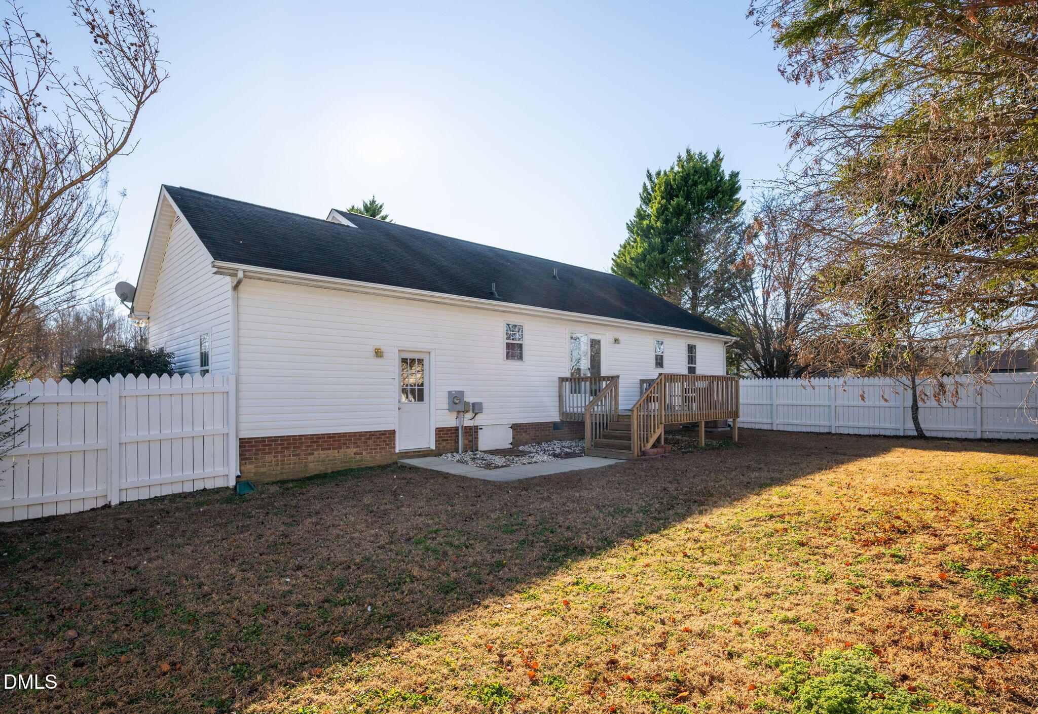 11 Hemlock Court Angier, NC 27501 - Photo 37 of 48 a view of a house with backyard and sitting area