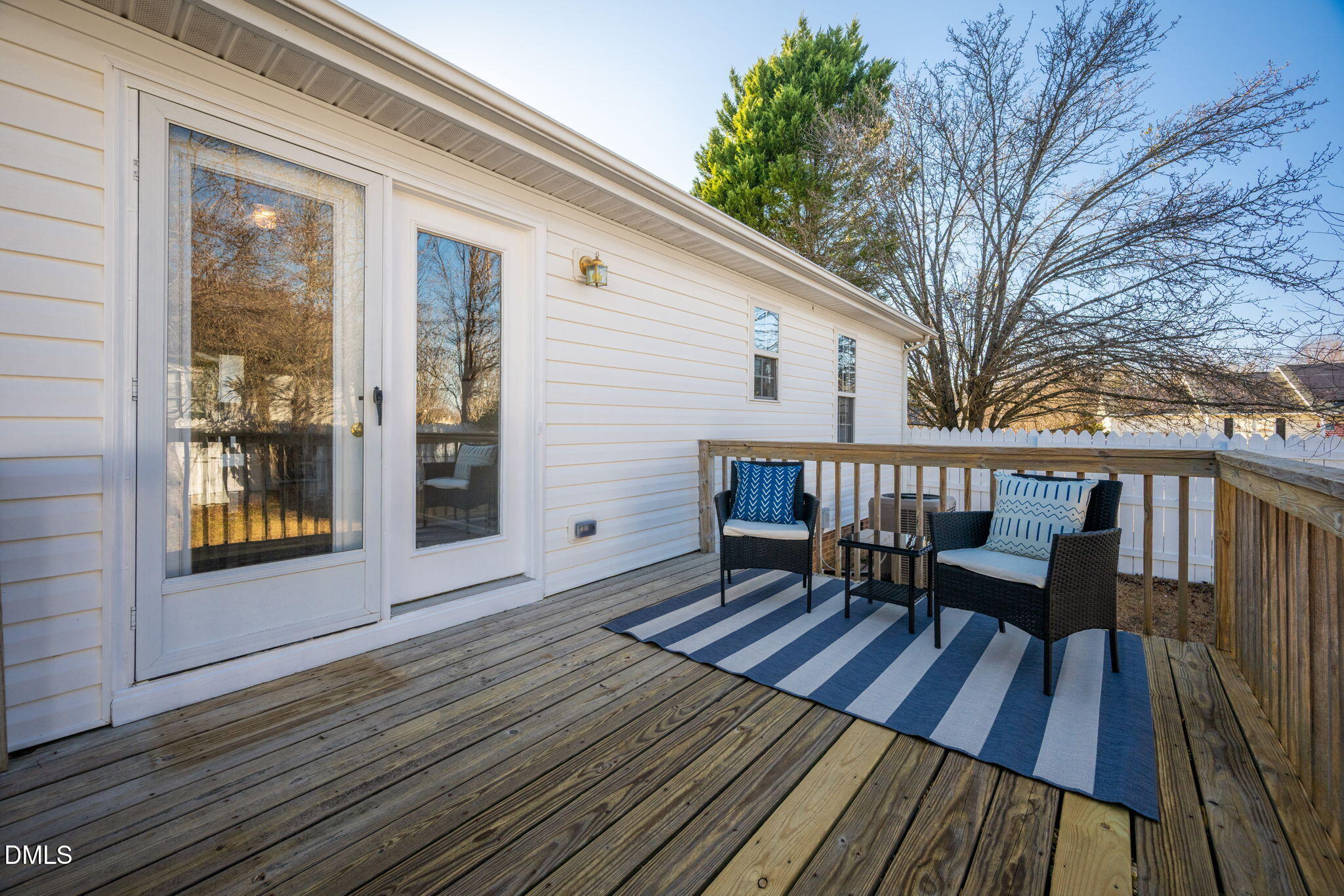 11 Hemlock Court Angier, NC 27501 - Photo 41 of 48 a view of a house with wooden deck and furniture