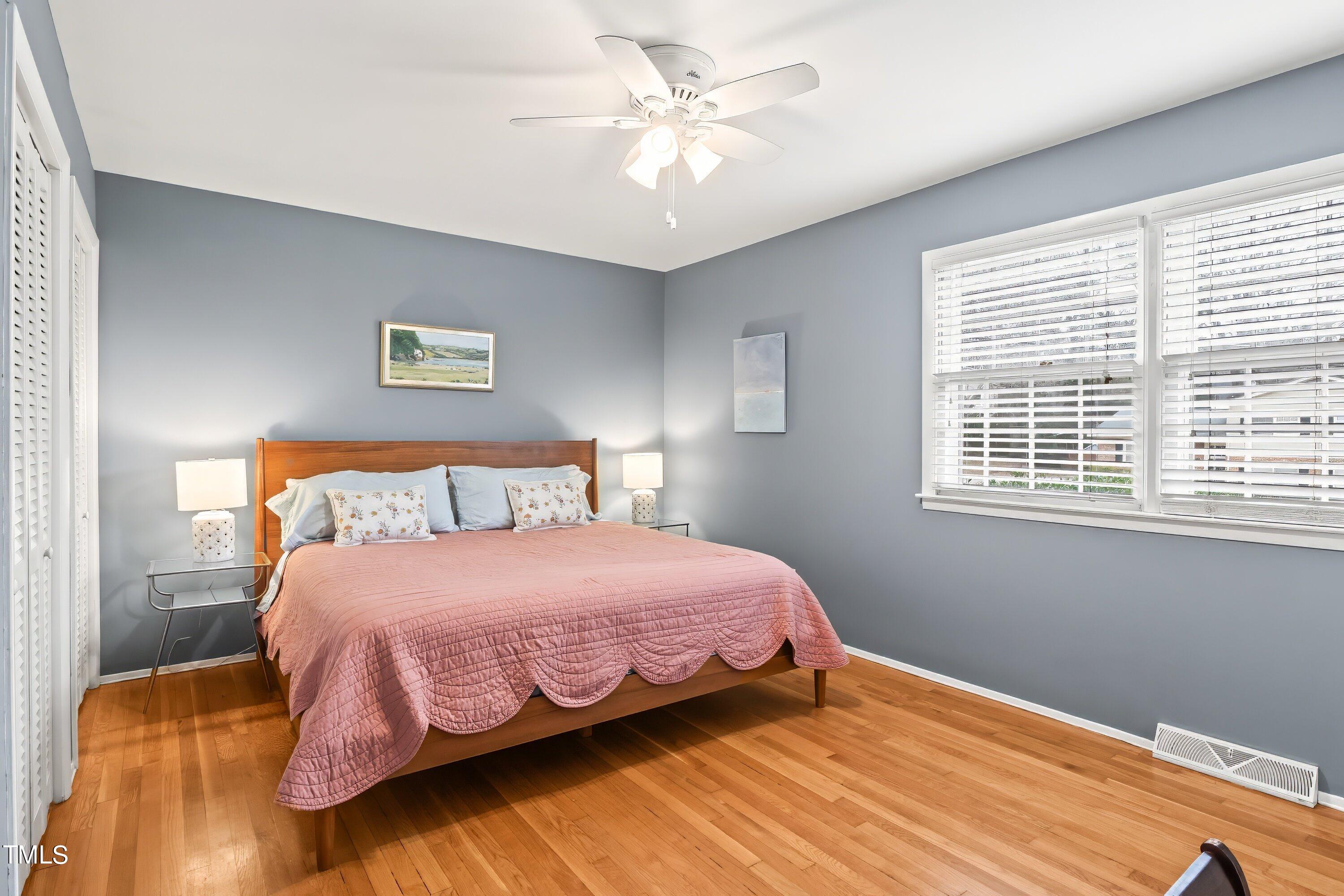 528 Harvard Street Raleigh, NC 27609 - Photo 13 of 44 a bedroom with a bed and a window