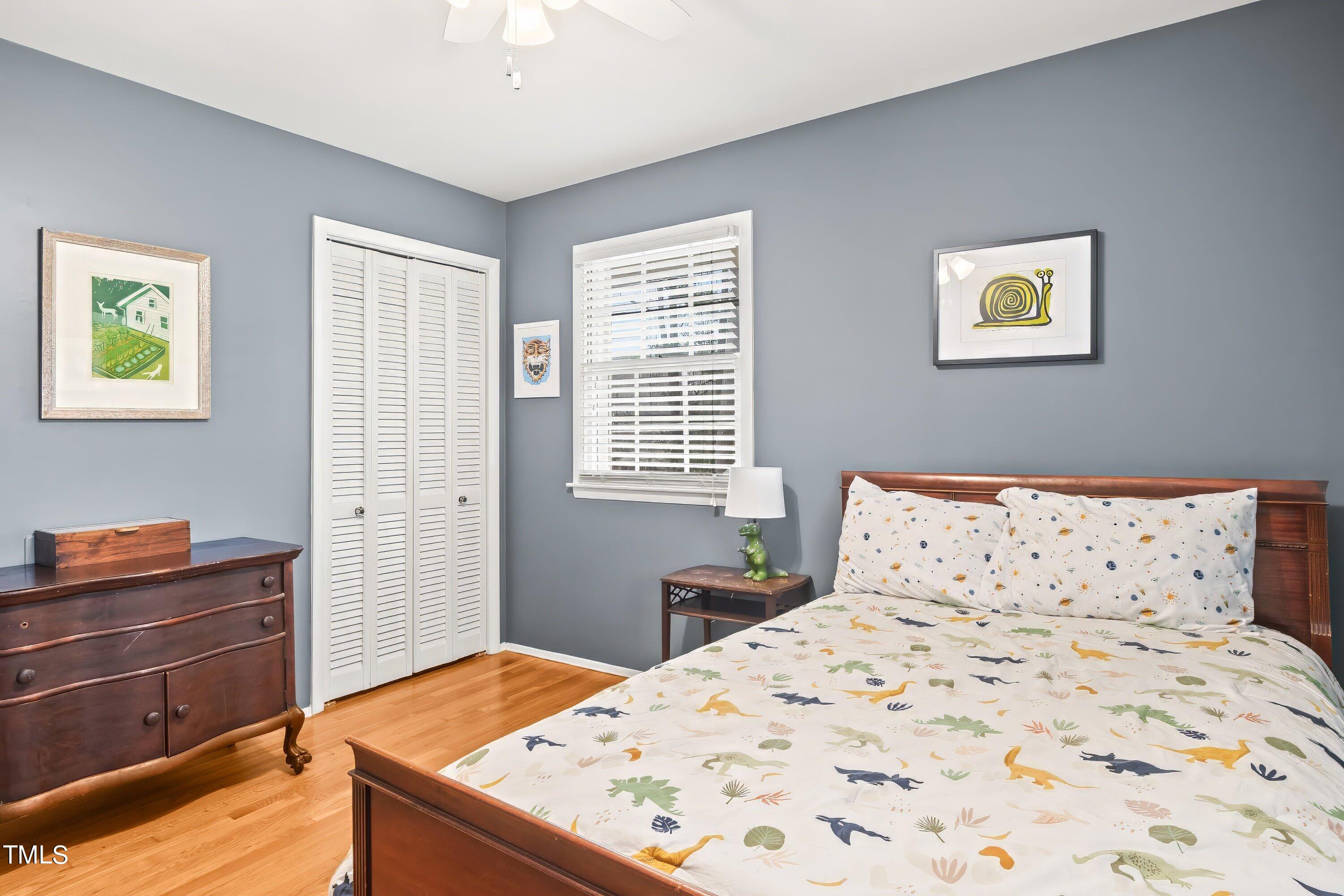 528 Harvard Street Raleigh, NC 27609 - Photo 22 of 44 a bedroom with a bed and a window