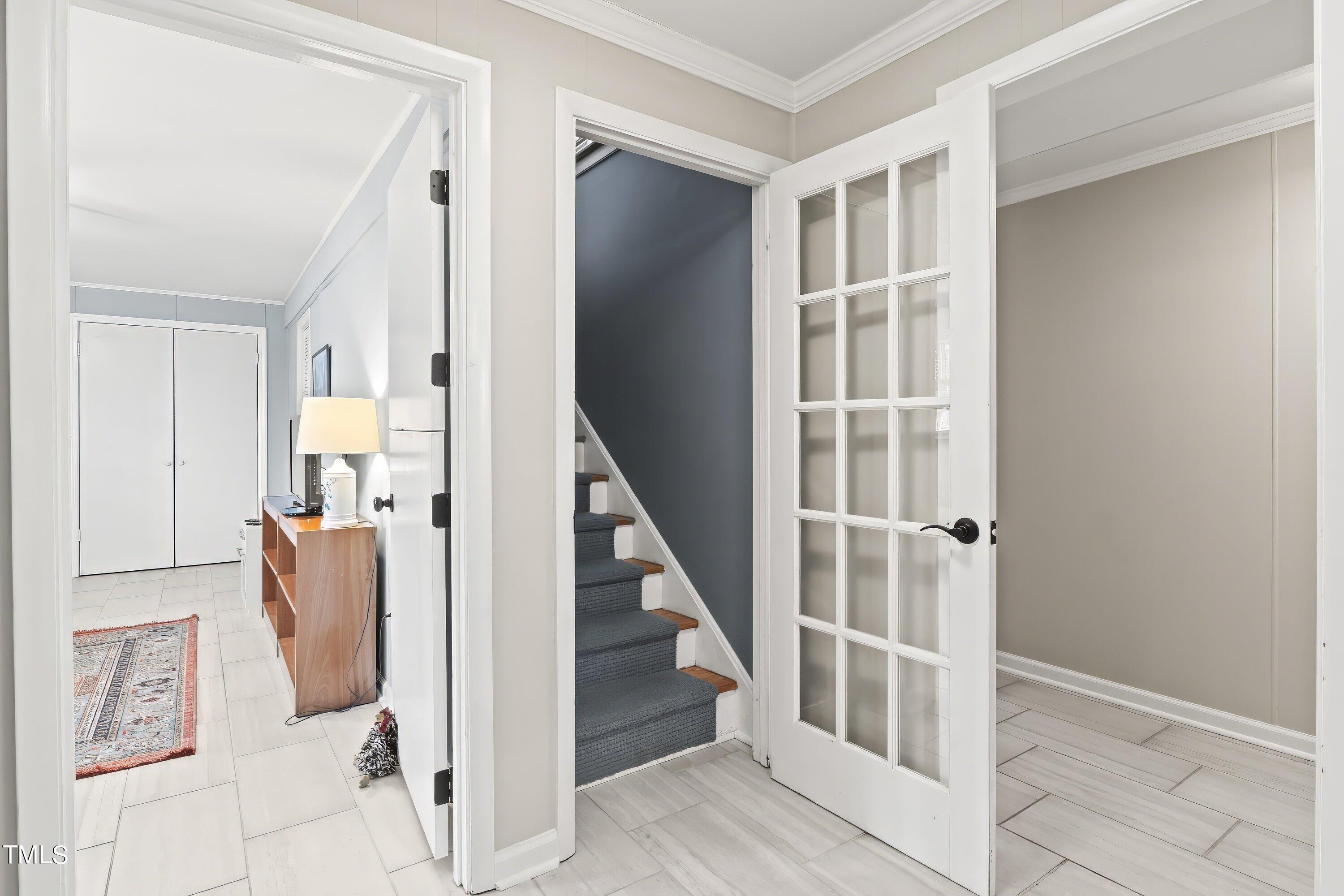 528 Harvard Street Raleigh, NC 27609 - Photo 23 of 44 a view of hallway with stairs and wooden floor