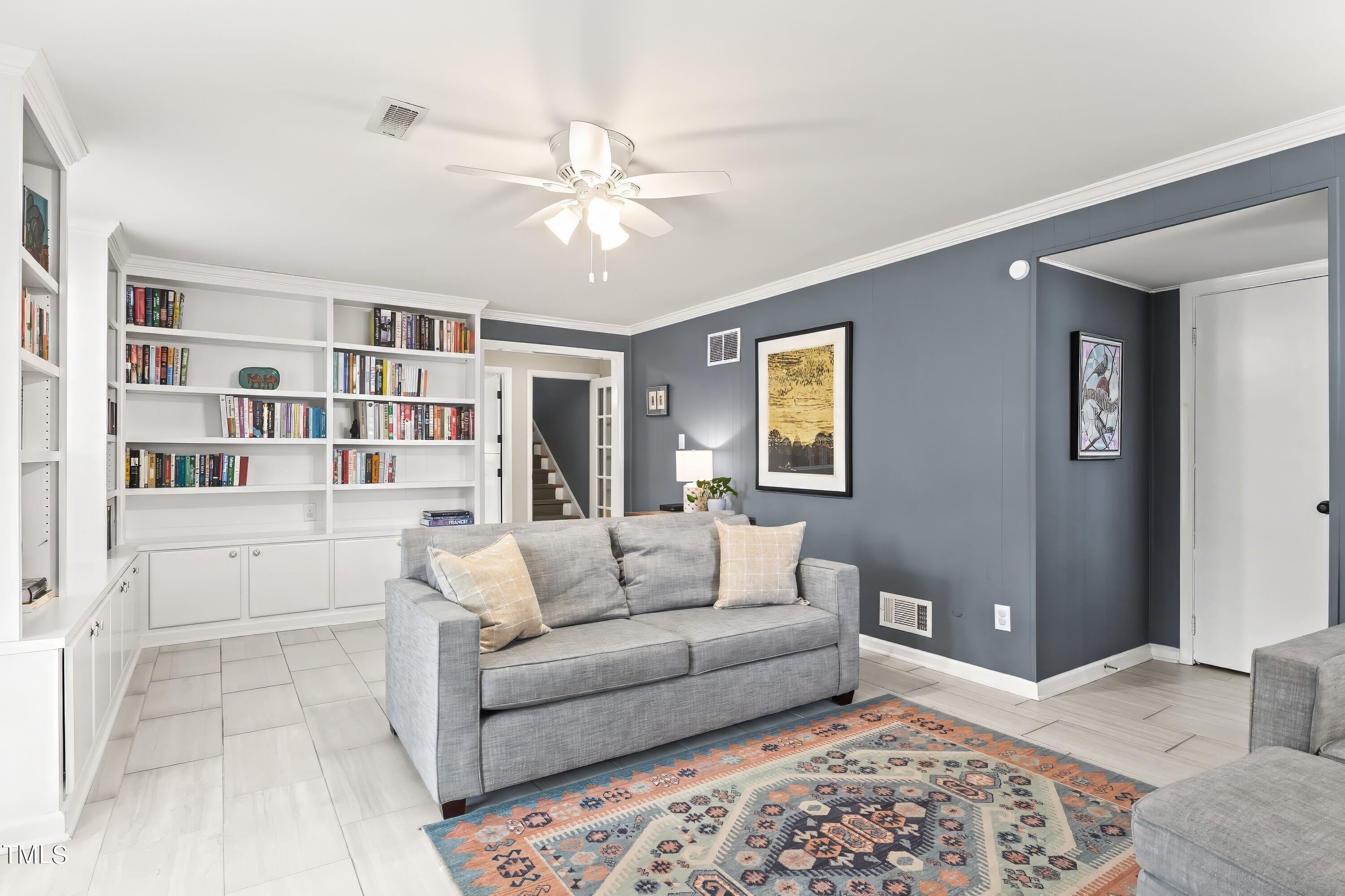 528 Harvard Street Raleigh, NC 27609 - Photo 25 of 44 a living room with furniture and a rug