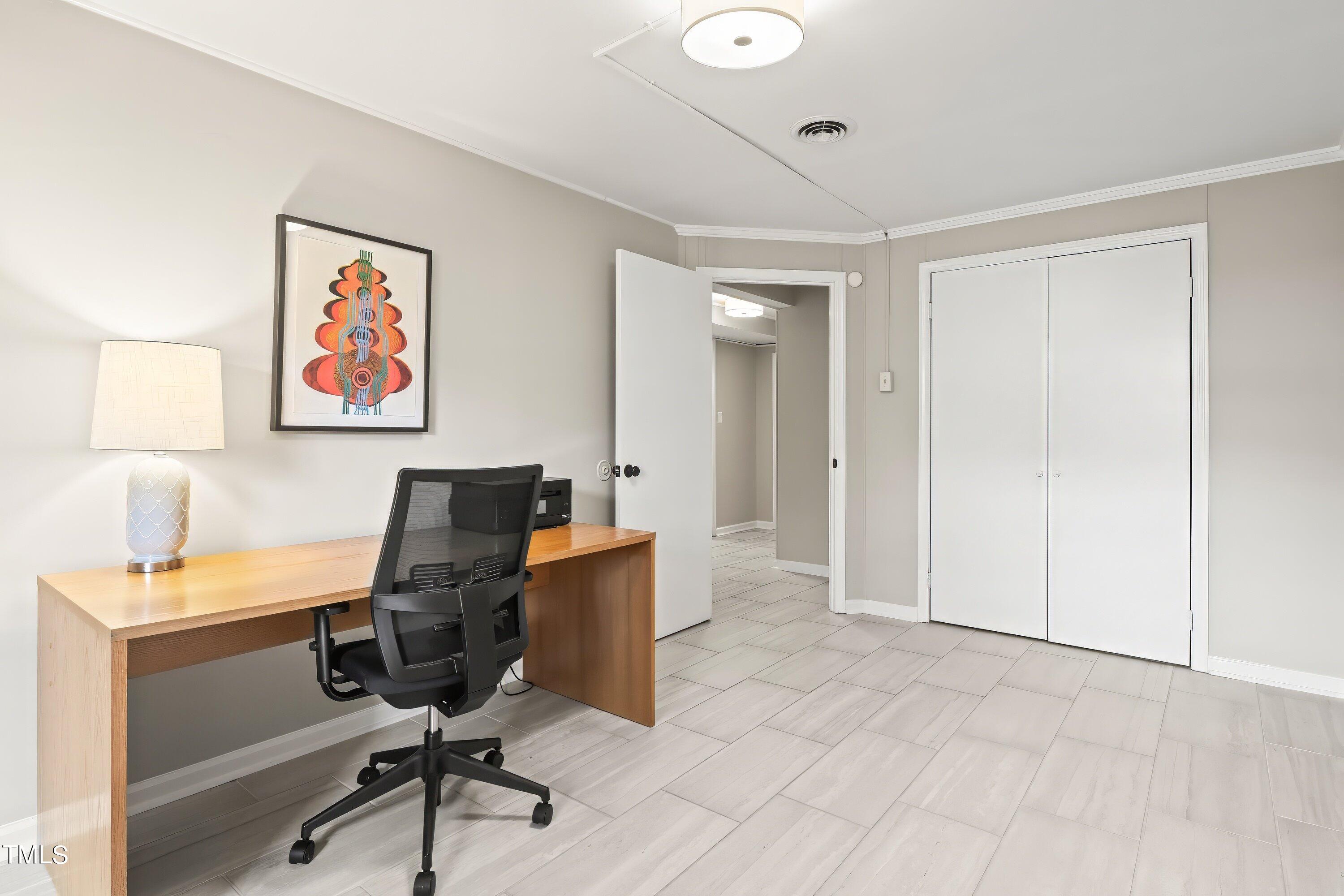 528 Harvard Street Raleigh, NC 27609 - Photo 34 of 44 a view of a workspace with furniture and a window
