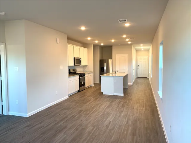a view of kitchen with wooden floor