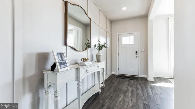 a spacious bathroom with a double vanity sink and a mirror