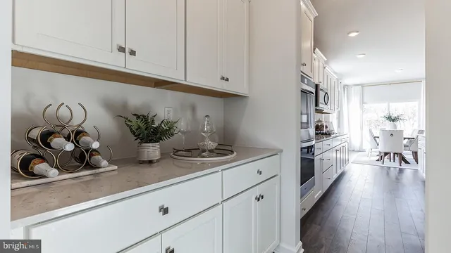 a kitchen with sink and cabinets