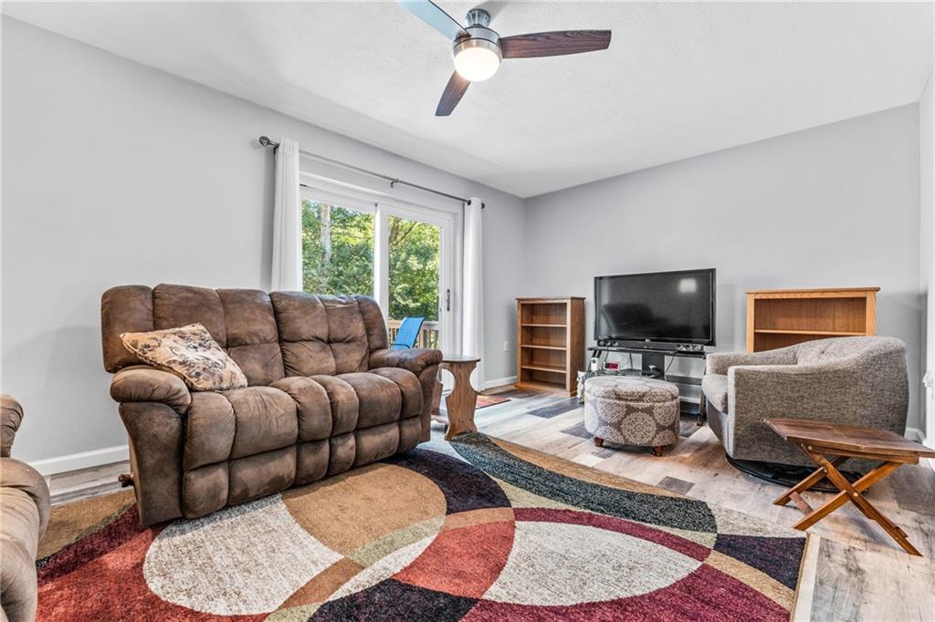 332 Central Drive Cranberry Township, PA 16066 - Photo 11 of 28 a living room with furniture a rug and a flat screen tv