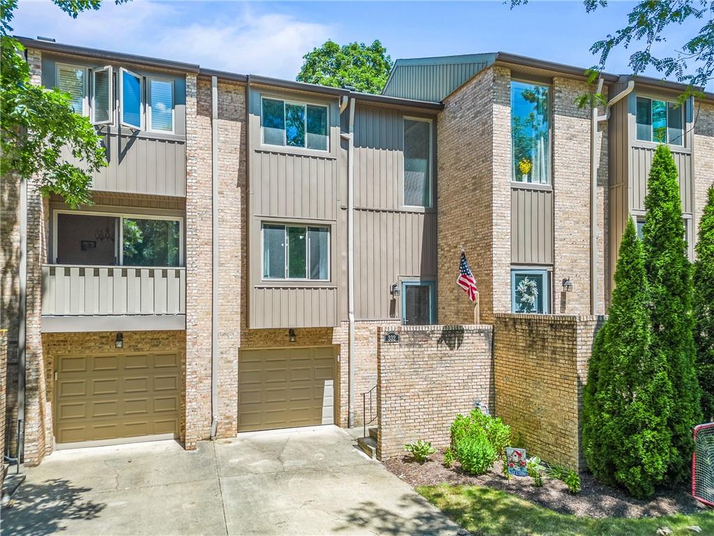 332 Central Drive Cranberry Township, PA 16066 - Photo 2 of 28 a front view of a house with a garden
