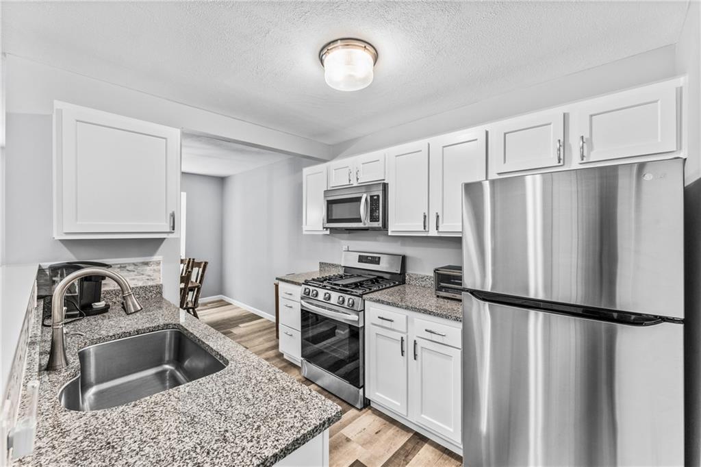 332 Central Drive Cranberry Township, PA 16066 - Photo 4 of 28 a kitchen with a refrigerator stove and microwave