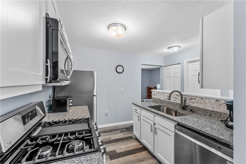 332 Central Drive Cranberry Township, PA 16066 - Photo 6 of 28 a kitchen with a stove and a sink