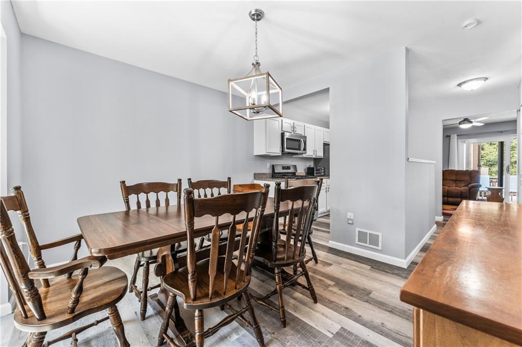 332 Central Drive Cranberry Township, PA 16066 - Photo 7 of 28 a view of a dining room with furniture a chandelier and wooden floor