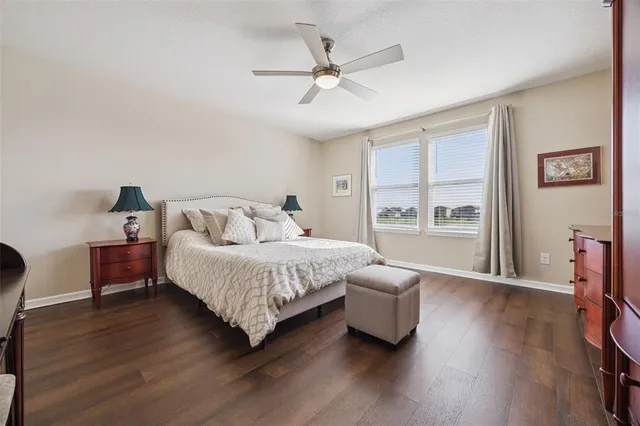 a view of walk in closet with clothes