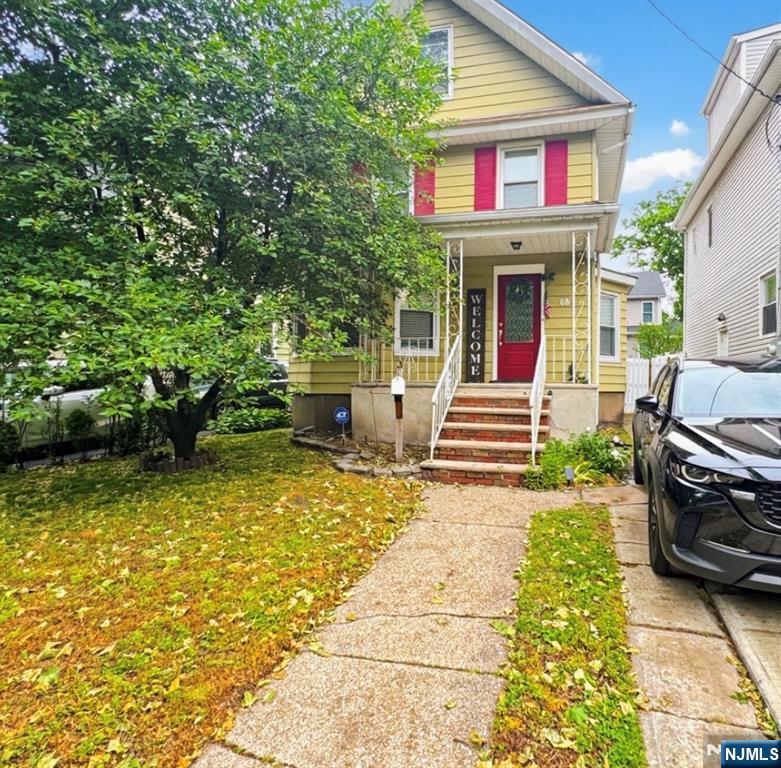 a front view of a house with garden