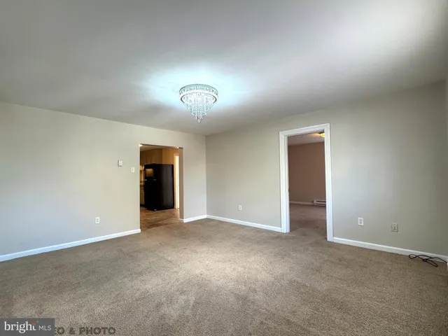 an empty room with a bathroom