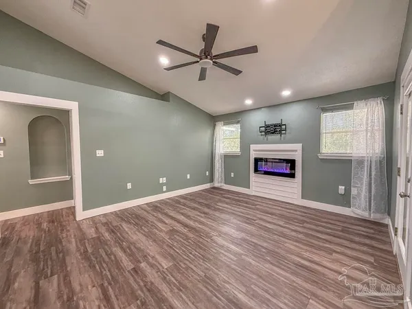 a view of livingroom with hardwood floor and ceiling fan