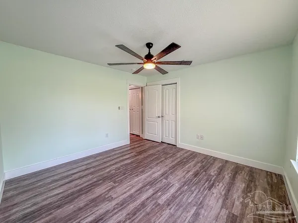 a view of an empty room with a fireplace