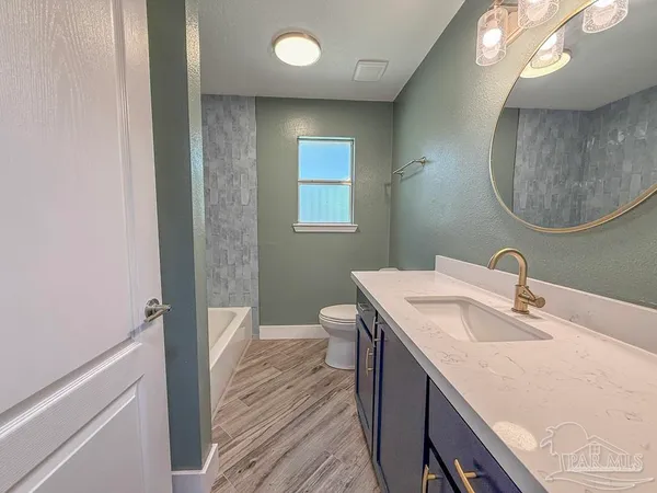 a view of livingroom with furniture and windows