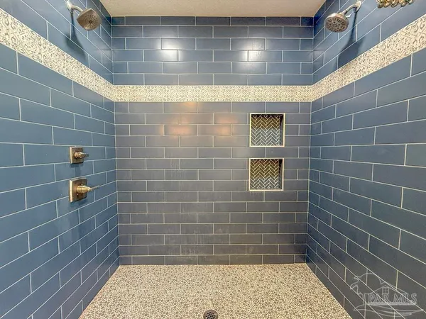a view of kitchen with stainless steel appliances granite countertop a stove a sink and a refrigerator