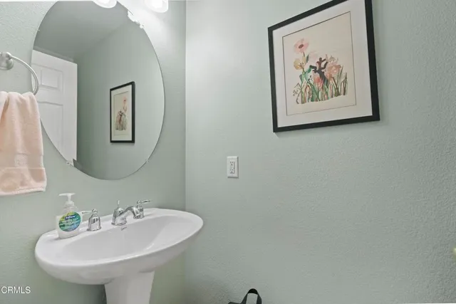 a bathroom with a sink and mirror