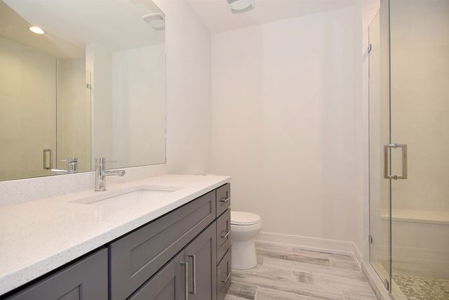 a bathroom with a sink a toilet and bathtub