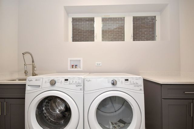 a bathroom with a granite countertop bathtub shower sink vanity and toilet