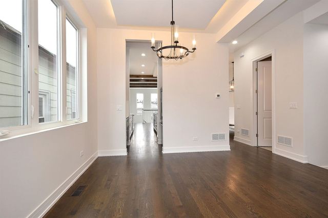 a view of kitchen and refrigerator