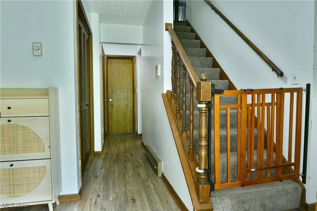 5531 Phillips Rice Road Cortland, OH 44410 - Photo 6 of 50 Staircase featuring wood finished floors and baseboards