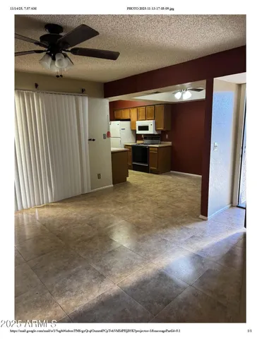 a view of kitchen with refrigerator sink and stove