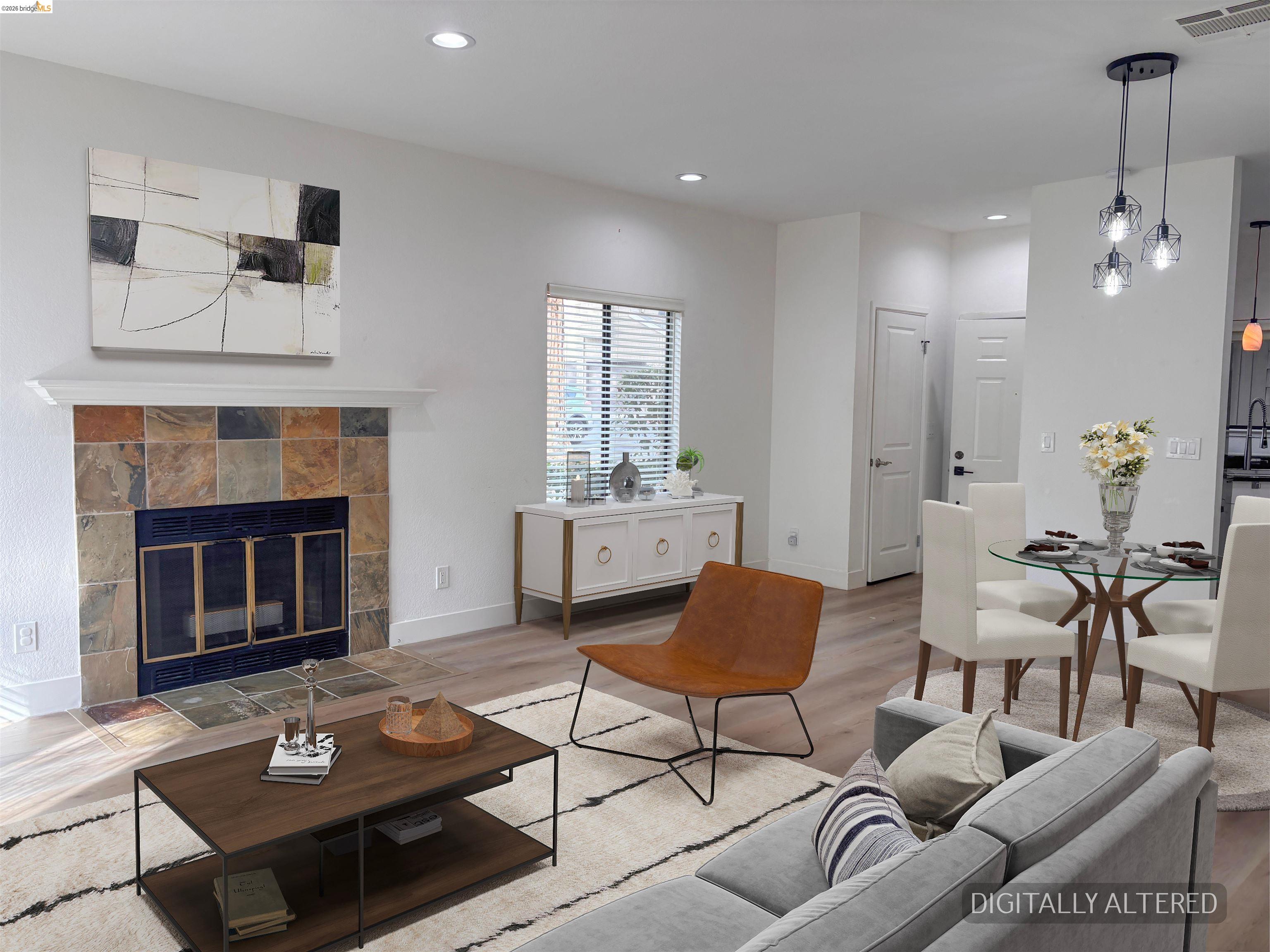 450 Pine Ridge Drive San Ramon, CA 94582 - Photo 9 of 18 a living room with furniture a fireplace and a table