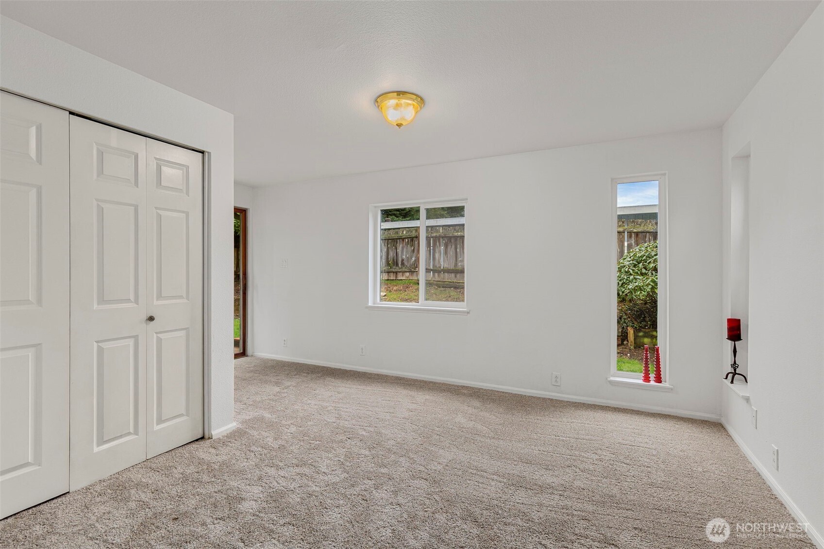 26009 Barrett Road Northeast Kingston, WA 98346 - Photo 15 of 25 a view of an empty room with a window